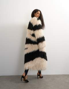 Model wearing Faux fur long collarless coat in mono print