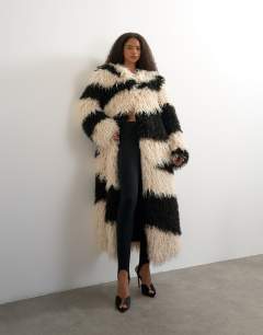 Model wearing Faux fur long collarless coat in mono print