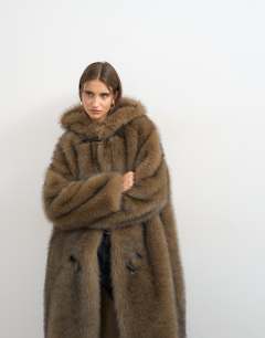 Model wearing Faux fur longline toggle coat in brown