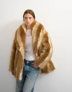 Model wearing Faux fur mid length coat in brown