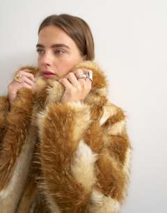 Model wearing Faux fur mid length coat in brown