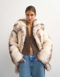 Model wearing Faux fur mid length coat in white stripe