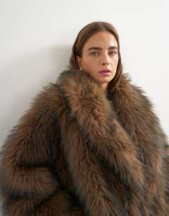 Model wearing Faux fur mid length shawl jacket in light brown