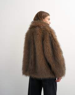 Model wearing Faux fur mid length shawl jacket in light brown
