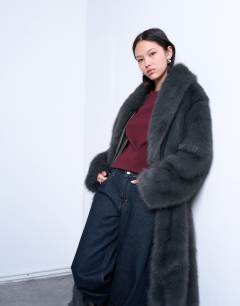 Model wearing Faux fur oversized shawl extra long coat in charcoal