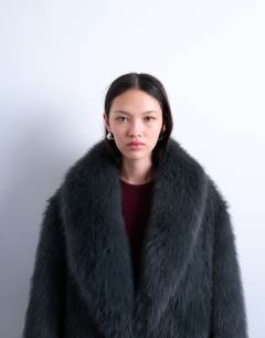 Model wearing Faux fur oversized shawl extra long coat in charcoal