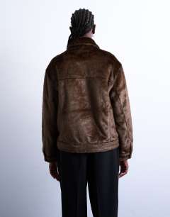 Model wearing Faux fur pony skin western trucker jacket in brown