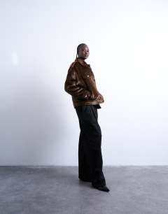 Model wearing Faux fur pony skin western trucker jacket in brown