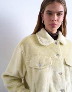 Model wearing Faux fur pony skin western trucker jacket in buttermilk