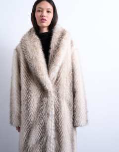 Model wearing Faux fur shawl longline coat in white stripe