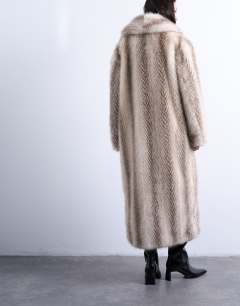 Model wearing Faux fur shawl longline coat in white stripe