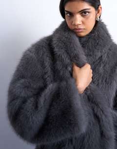 Model wearing Faux fur shawl mid length coat in charcoal