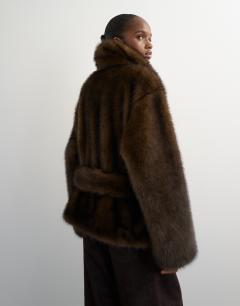 Model wearing Faux fur short belted coat in brown