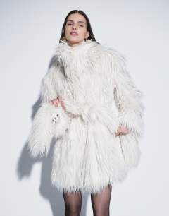 Model wearing Faux fur short cinched waist short coat in white