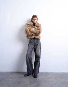 Model wearing Faux fur stripe zip thru bomber jacket in light brown