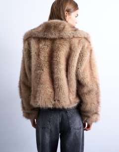 Model wearing Faux fur stripe zip thru bomber jacket in light brown