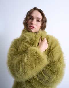 Model wearing Faux fur super long coat in green