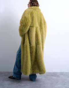 Model wearing Faux fur super long coat in green