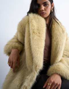 Model wearing Faux fur super long oversized shawl coat in buttermilk