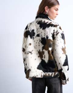 Model wearing Faux fur western trucker jacket in cow print