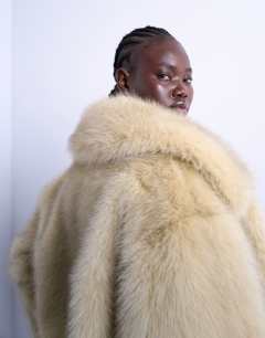 Model wearing Faux fur zip thru bomber jacket in buttermilk