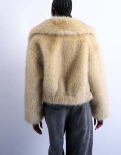 Model wearing Faux fur zip thru bomber jacket in buttermilk