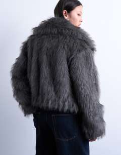 Model wearing Faux fur zip thru bomber jacket in grey