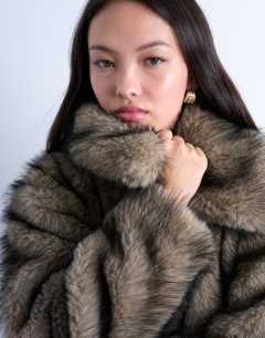 Model wearing Faux fur zip thru bomber jacket in natural