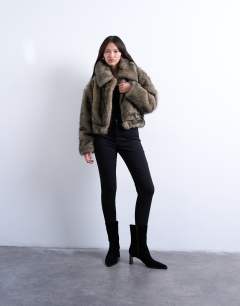 Model wearing Faux fur zip thru bomber jacket in natural