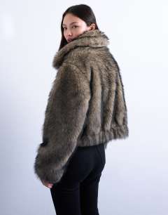 Model wearing Faux fur zip thru bomber jacket in natural