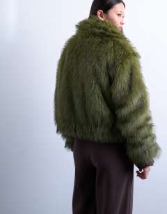 Model wearing Faux fur zip thru bomber jacket in olive