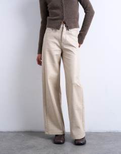 Model wearing Faux leather A line trouser in ecru