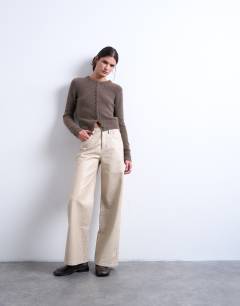 Model wearing Faux leather A line trouser in ecru