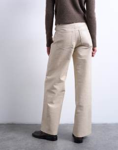 Model wearing Faux leather A line trouser in ecru