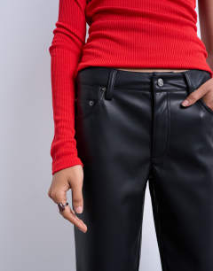 Model wearing Faux leather ankle grazer trouser in black