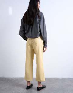 Model wearing Faux leather ankle grazer trouser in buttermilk