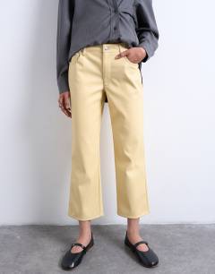 Model wearing Faux leather ankle grazer trouser in buttermilk