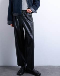 Model wearing Faux leather awkward length pull on trouser in black