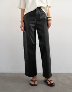 Model wearing Faux leather barrel leg trouser in black