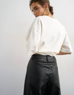 Model wearing Faux leather barrel leg trouser in black