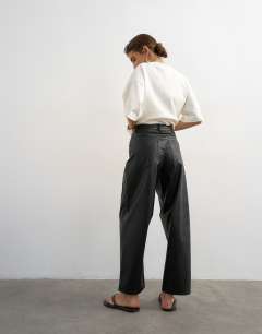 Model wearing Faux leather barrel leg trouser in black