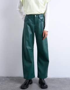Model wearing Faux leather barrel leg trouser in teal