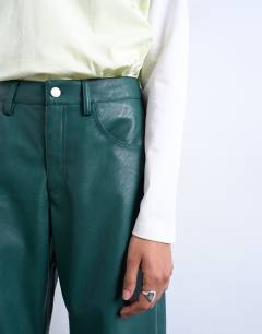 Model wearing Faux leather barrel leg trouser in teal