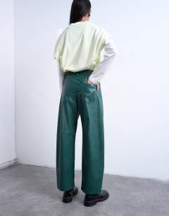 Model wearing Faux leather barrel leg trouser in teal