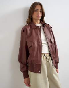 Model wearing Faux leather bomber jacket in burgundy