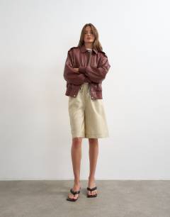 Model wearing Faux leather bomber jacket in burgundy