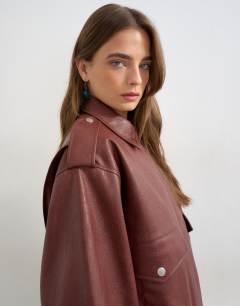 Model wearing Faux leather bomber jacket in burgundy