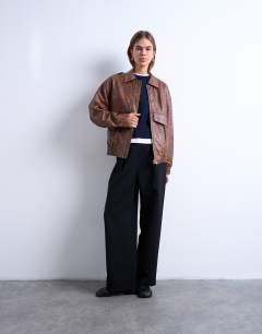 Model wearing Faux leather bomber jacket in washed brown