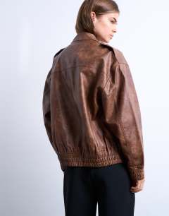 Model wearing Faux leather bomber jacket in washed brown