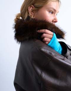 Model wearing Faux leather boxy zip through pocket bomber jacket with detachable fur collar in washed brown